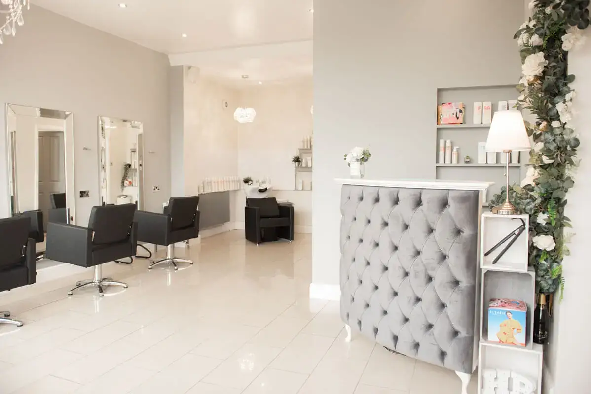 Elegant, serene salon interior with chic furniture.