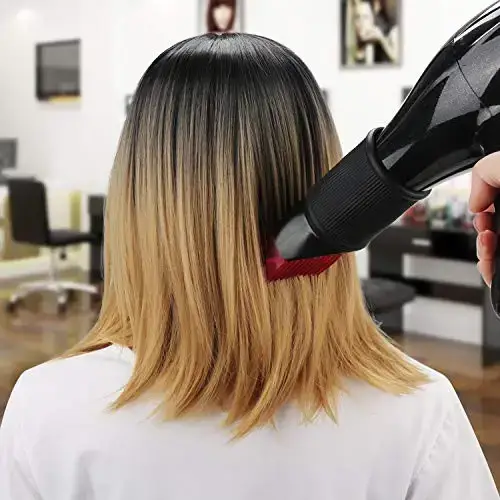 Person drying bottom half of two-toned hair with a hairdryer.