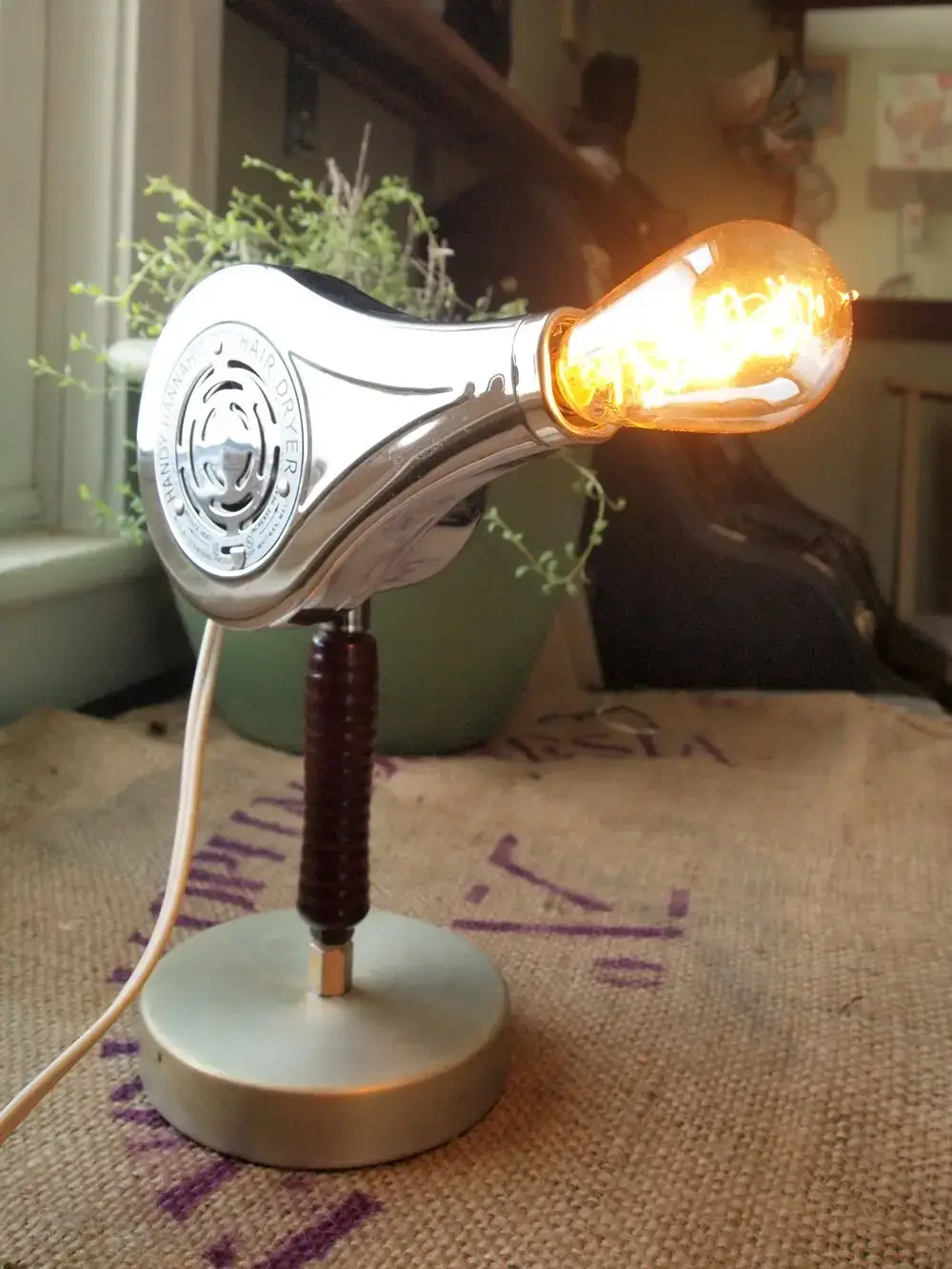 Upcycled hair dryer turned into a novel desk lamp.