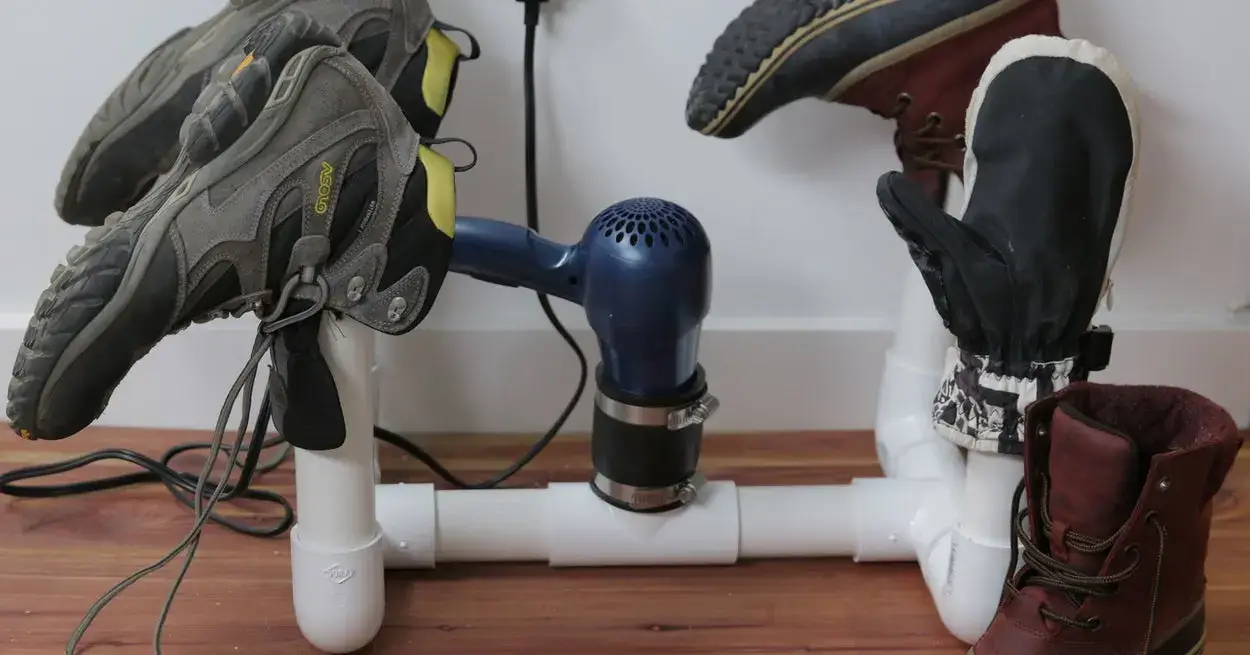 Hair dryer used to speed up drying boots on PVC.