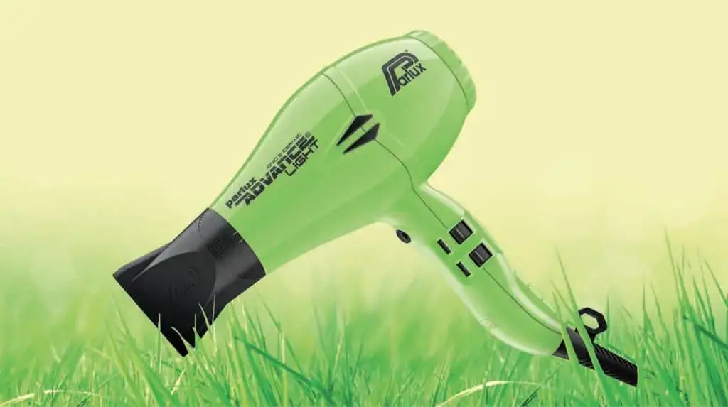 Green eco-friendly hair dryer on grass.