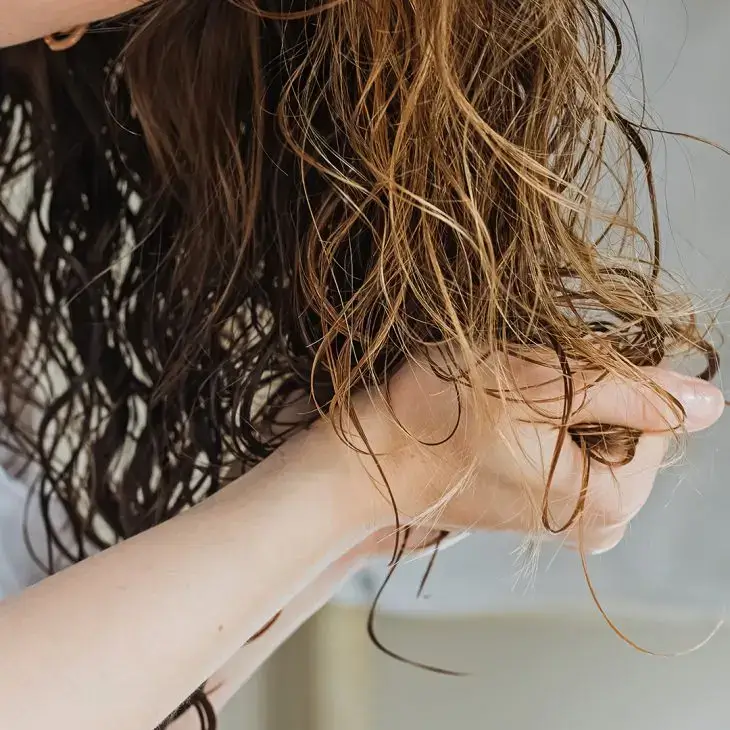 gently squeeze out excess water for hair