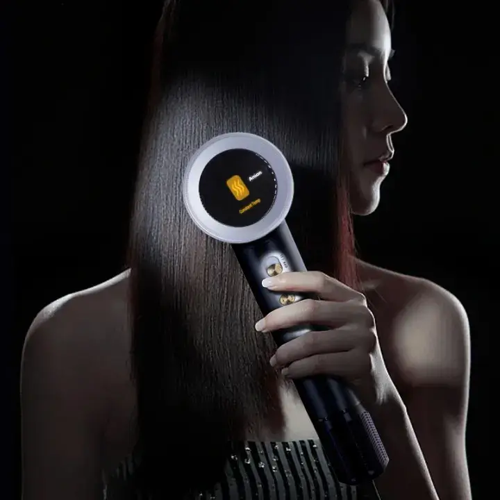 Woman using a modern, sleek hair dryer on hair.
