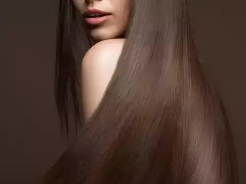 Luxurious long brown hair covering half the face.