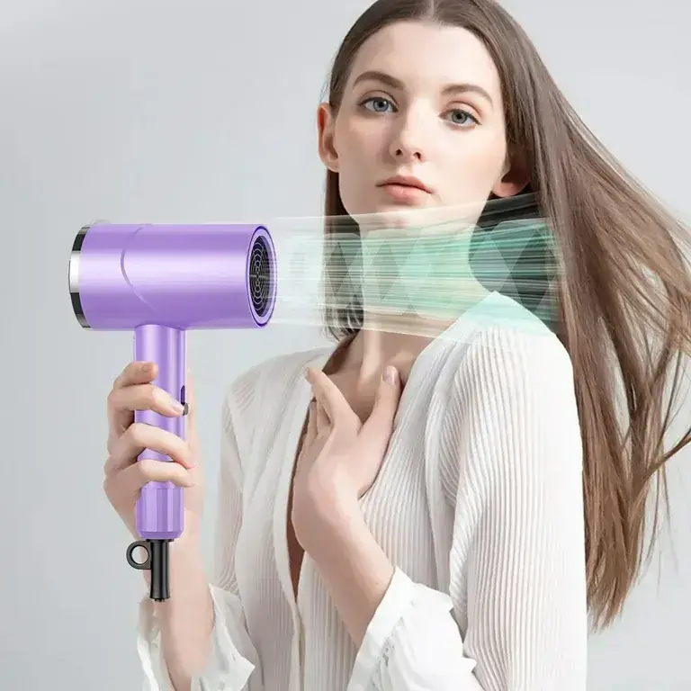 Woman holding purple hairdryer, simulating wind on her face.