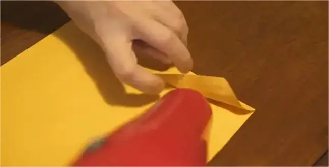 Opening a sealed envelope carefully with a hairdryer.