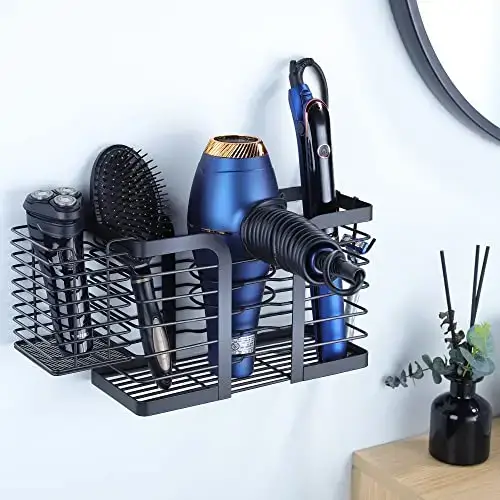 a holder with a hair dryer and other hair tools hanging on wall