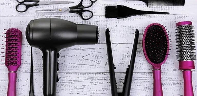 Hair styling tools with a focus on the hair dryer.