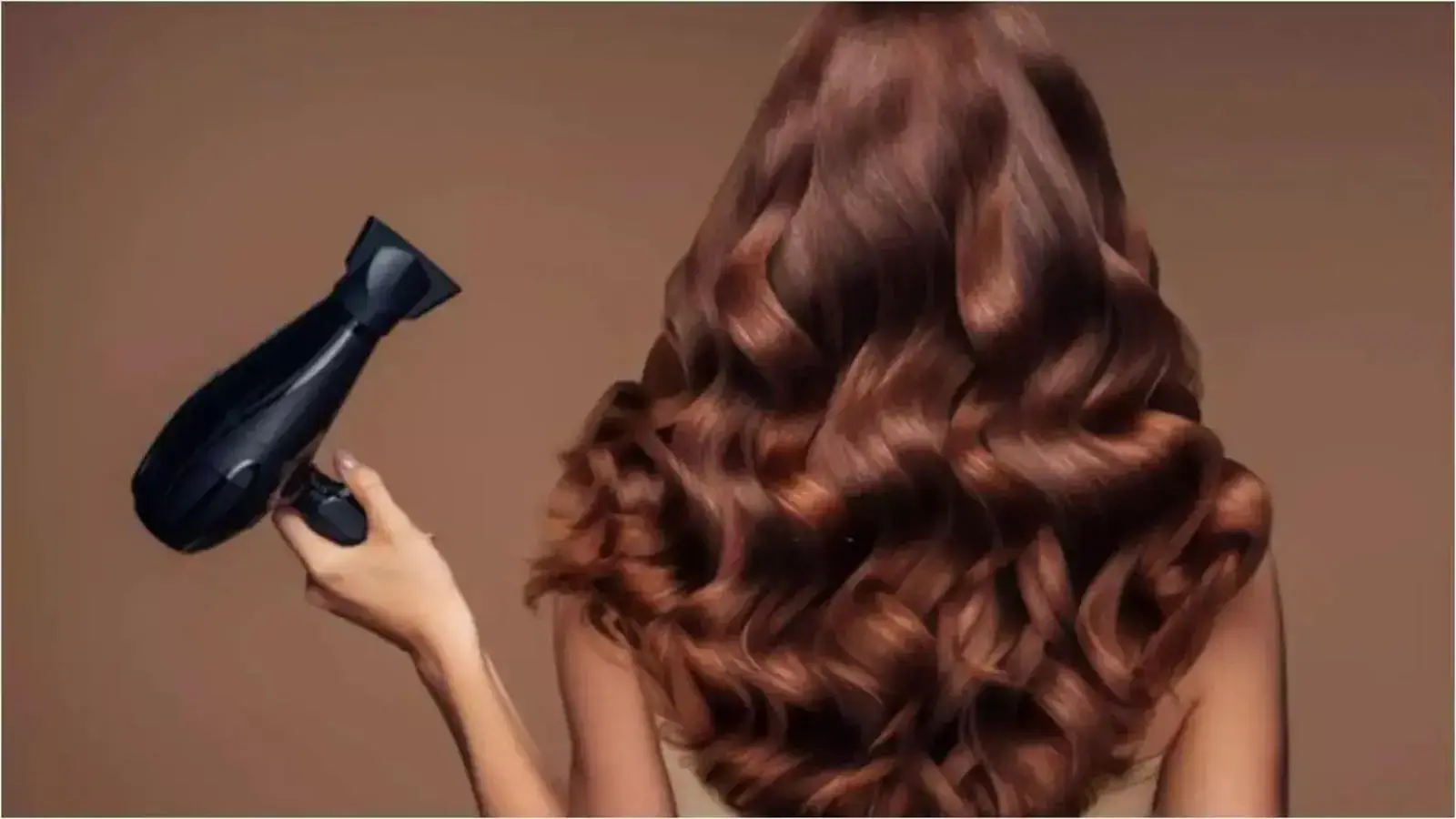 Luxurious curls styled with a black hairdryer.