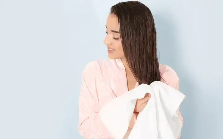 Gently towel-dry your hair